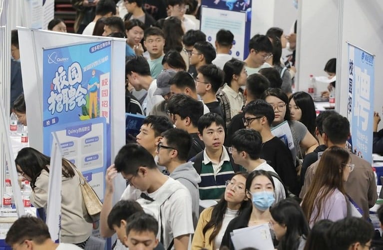 Young people attending a job fair at Shanghai University