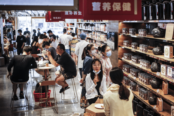Young consumers in a shop that sells herb-infused coffees